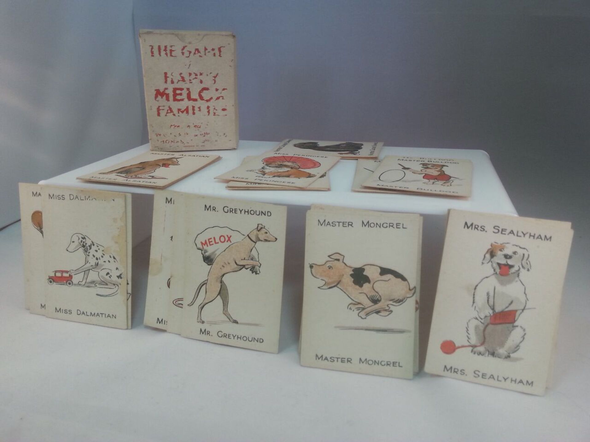 ANTIQUE MELOX HAPPY DOG FAMILIES CARD GAME - COMPLETE IN BOX. A scarce card game, originally