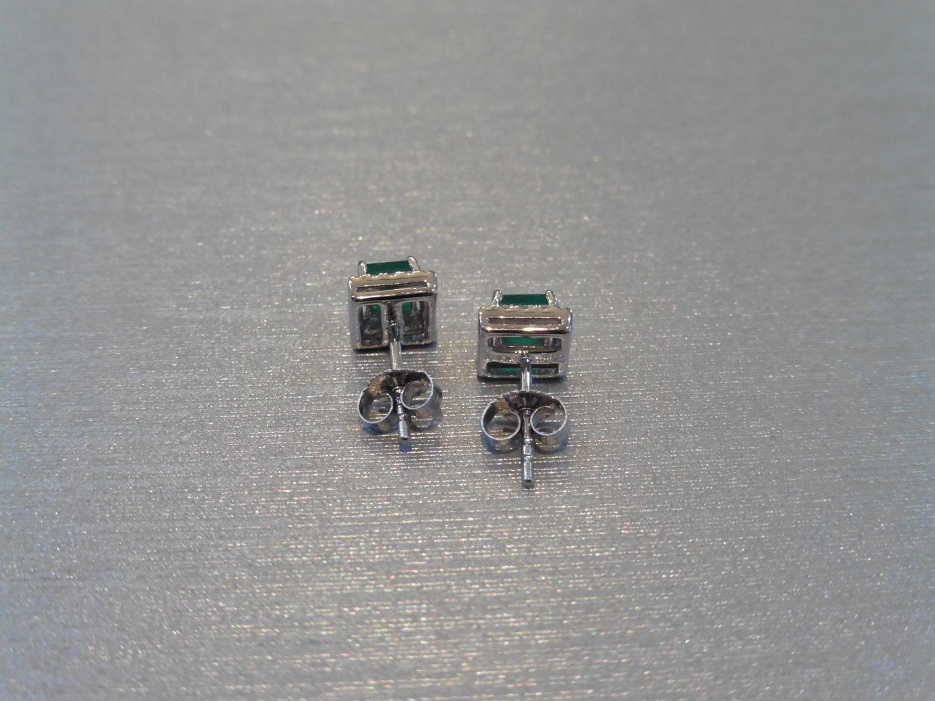 Brand new 9ct white gold emerald and diamond stud style earrings. Each set with a square cut emerald - Image 2 of 3