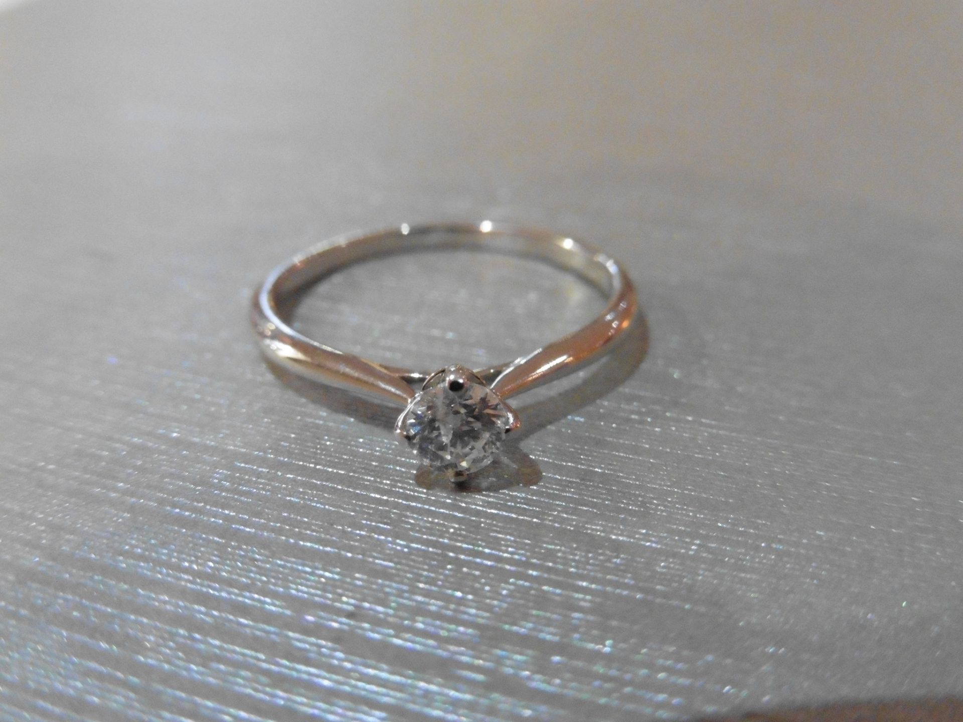 Brand new 18ct white gold diamond solitaire ring set with a 0.30ct brilliant cut diamond, H/I colour