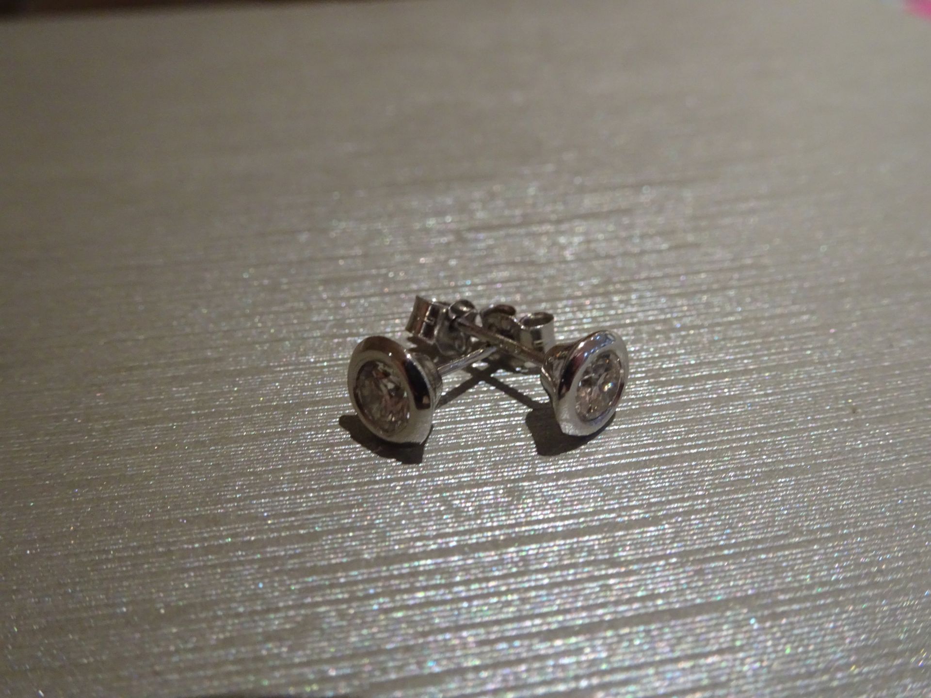 Brand new 18ct white gold diamond solitaire style earrings each set with a brilliant cut diamond, - Image 2 of 3