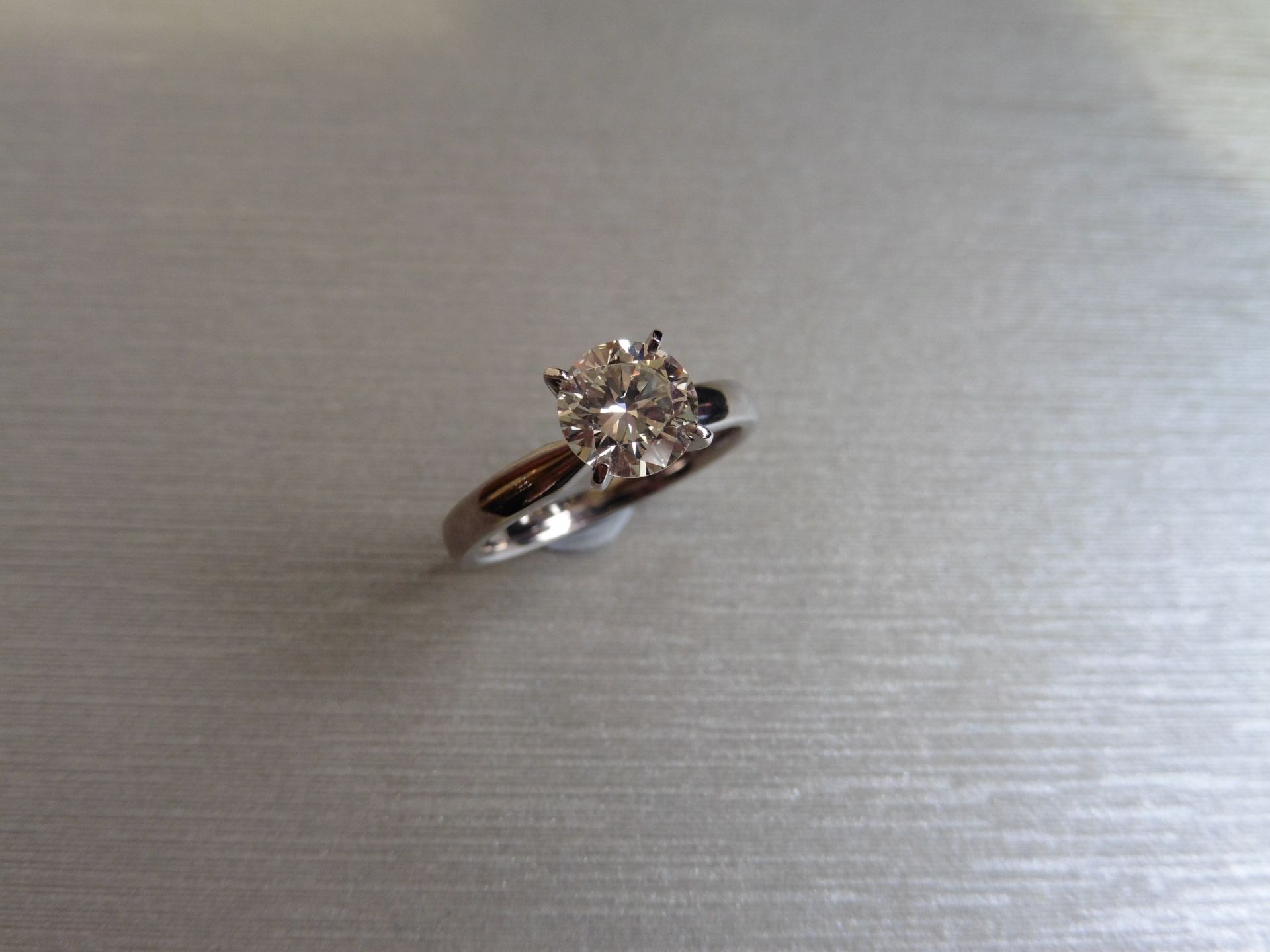 Brand new 18ct white gold diamond solitaire ring. Set with a 1.26ct brilliant cut diamond (
