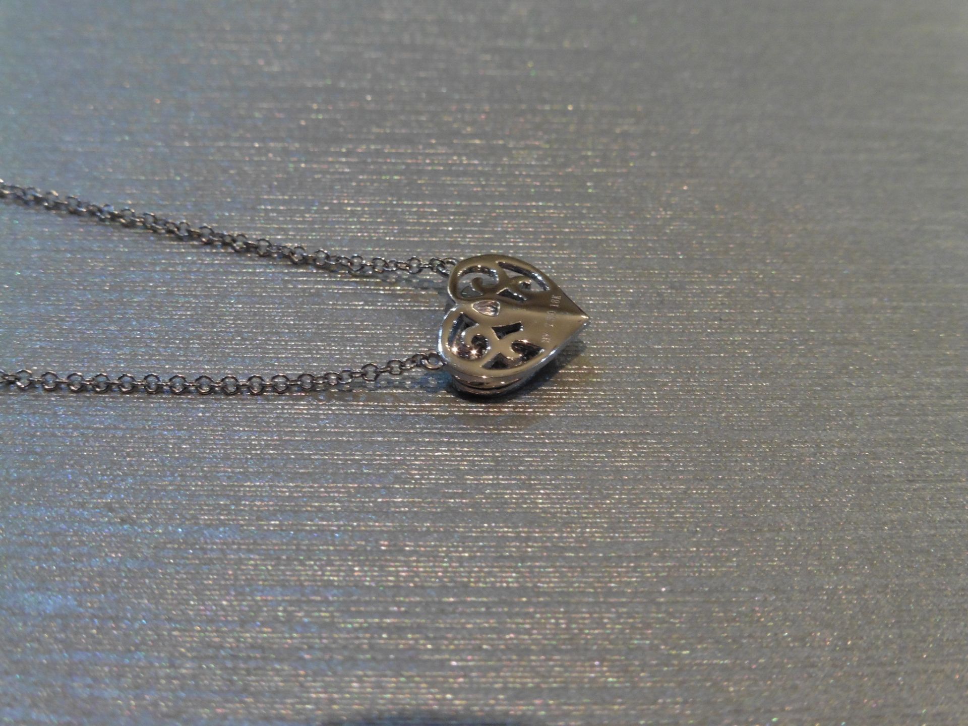 Brand new 18ct white gold diamond set heart pendant and chain. Micro set with tiny brilliant cut - Image 2 of 3