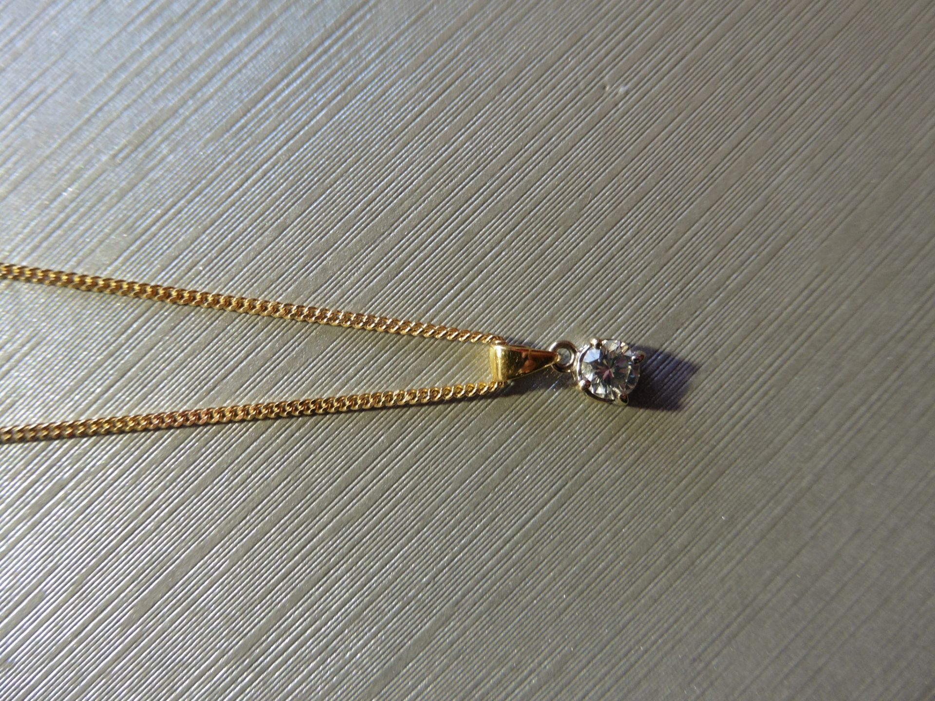 Brand new 18ct yellow gold diamond solitaire style pendant set with a single brilliant cut diamond