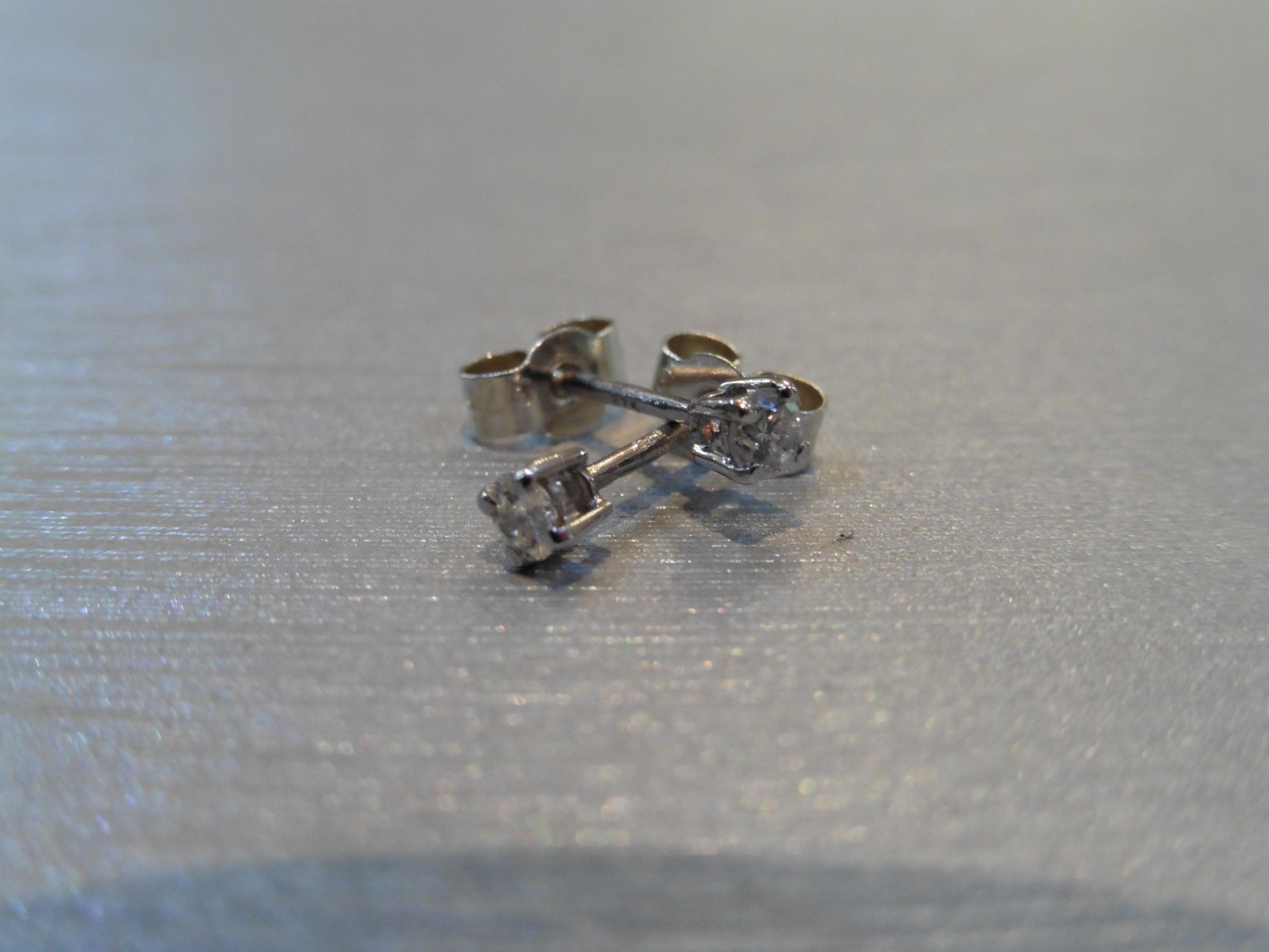 Brand new 9ct white gold solitaire stud earrings each set with a brilliant cut diamond weighing a - Image 2 of 3