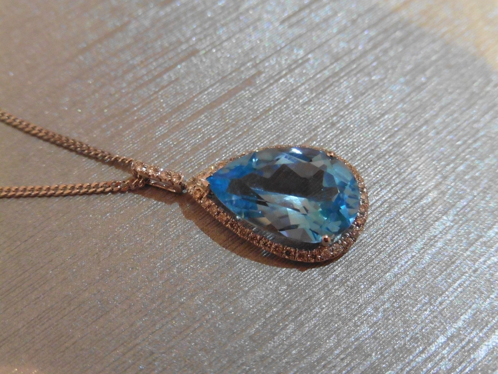 Brand new 9ct white gold blue topaz and diamond pendant. Set with a pear shaped blue topaz - Image 3 of 3
