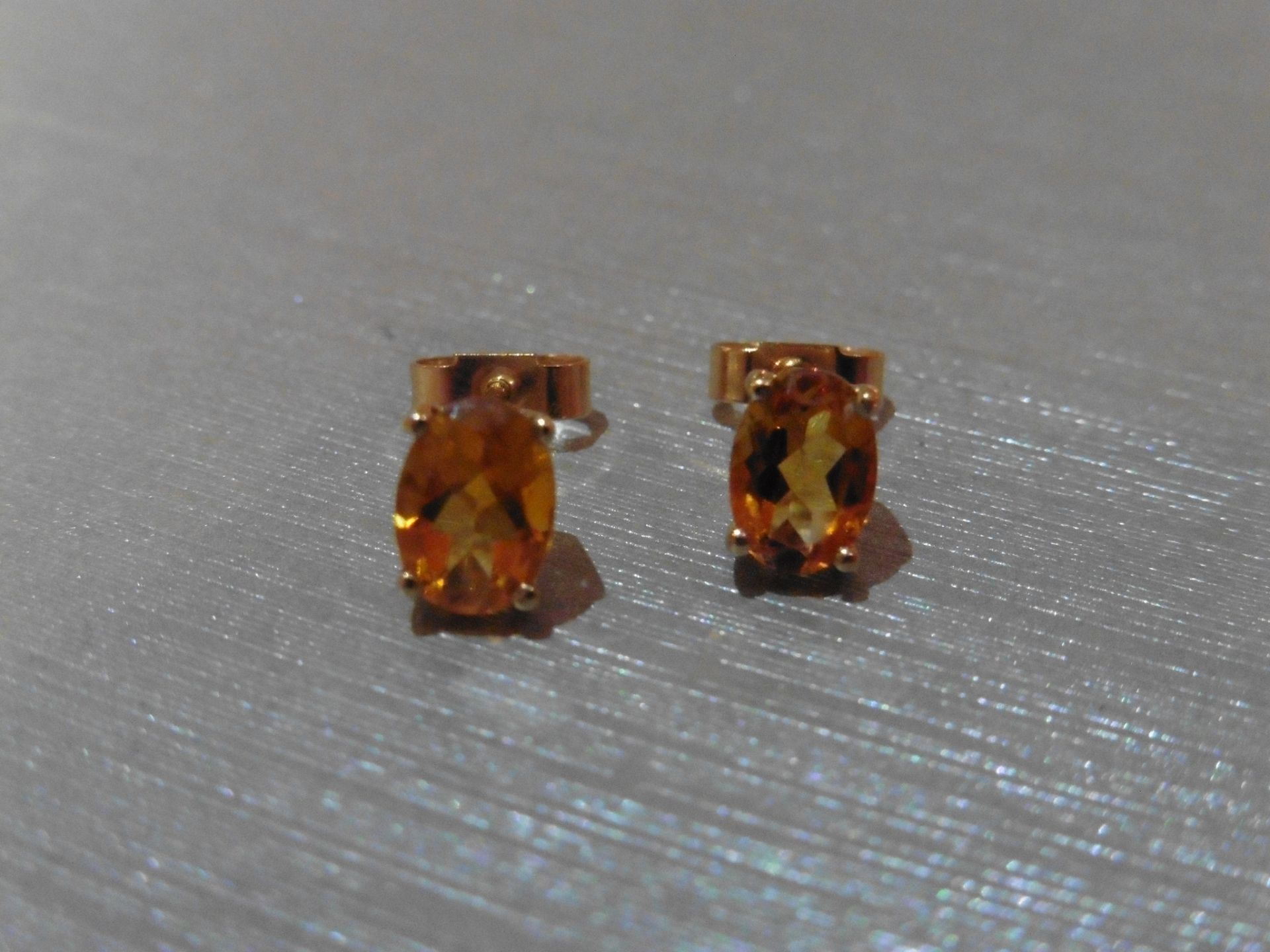 Brand new 9ct yellow gold citrine stud style earrings each set with an oval cut Citrine (