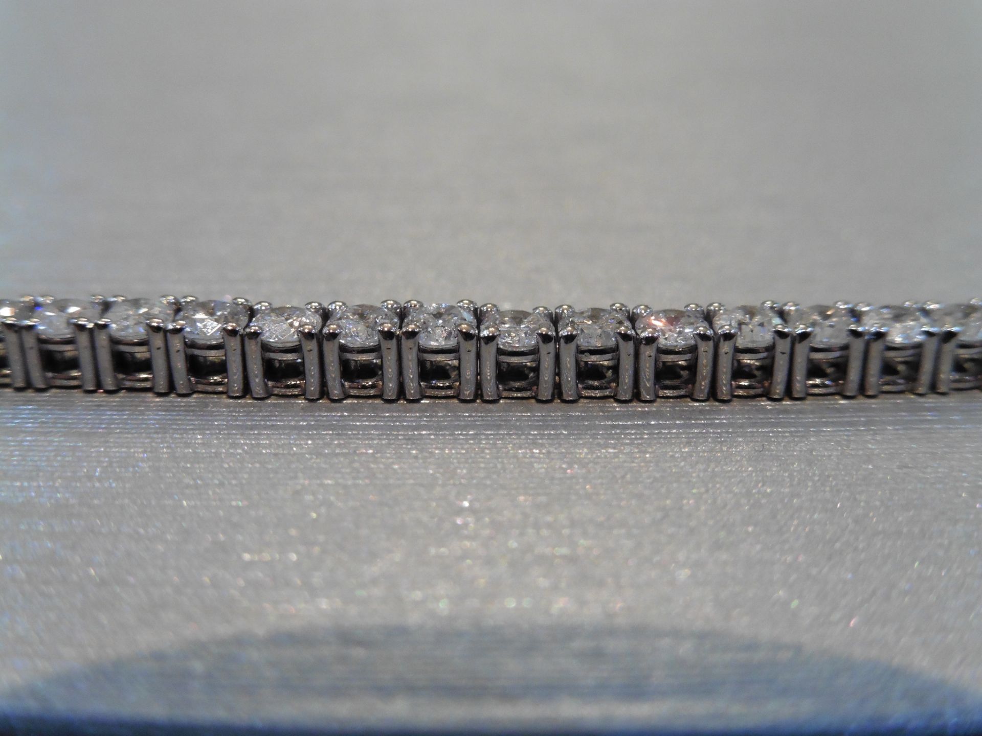 Brand new 18ct white gold tennis bracelet set with brilliant cut diamonds of H/I colour weighing 3. - Image 4 of 4