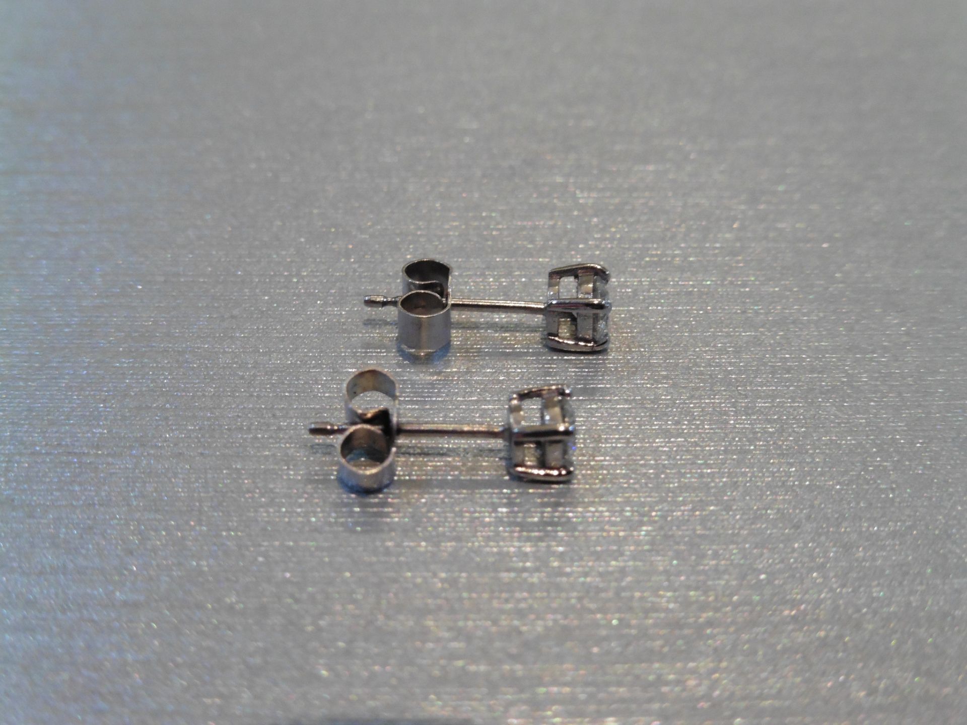 Brand new 18ct white gold solitaire stud earrings each set with a brilliant cut diamond weighing a - Image 2 of 3