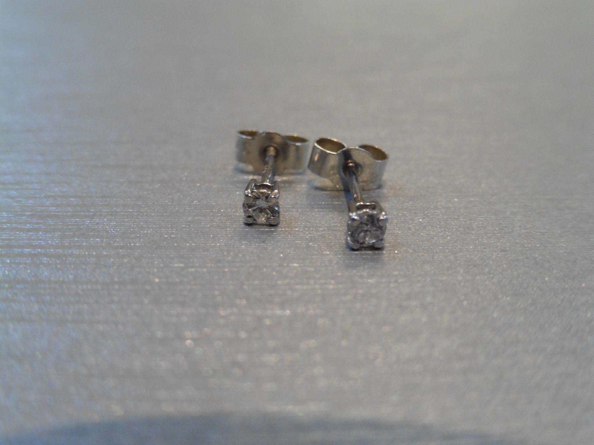 Brand new 9ct white gold solitaire stud earrings each set with a brilliant cut diamond weighing a - Image 3 of 3