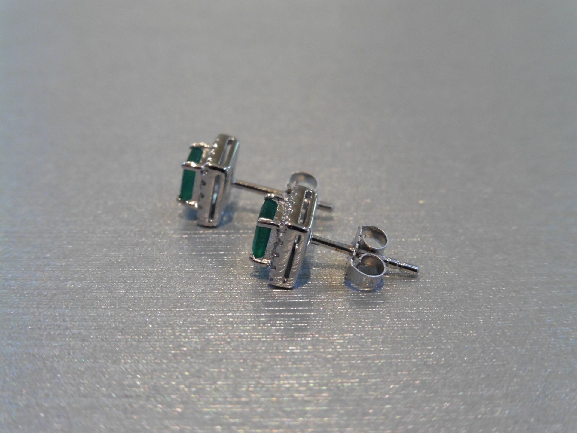 Brand new 9ct white gold emerald and diamond stud style earrings. Each set with a square cut emerald - Image 3 of 3