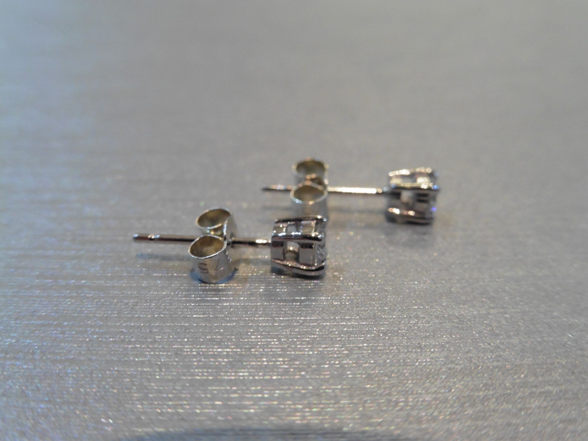Brand new 9ct white gold solitaire stud earrings each set with a brilliant cut diamond weighing a - Image 2 of 3