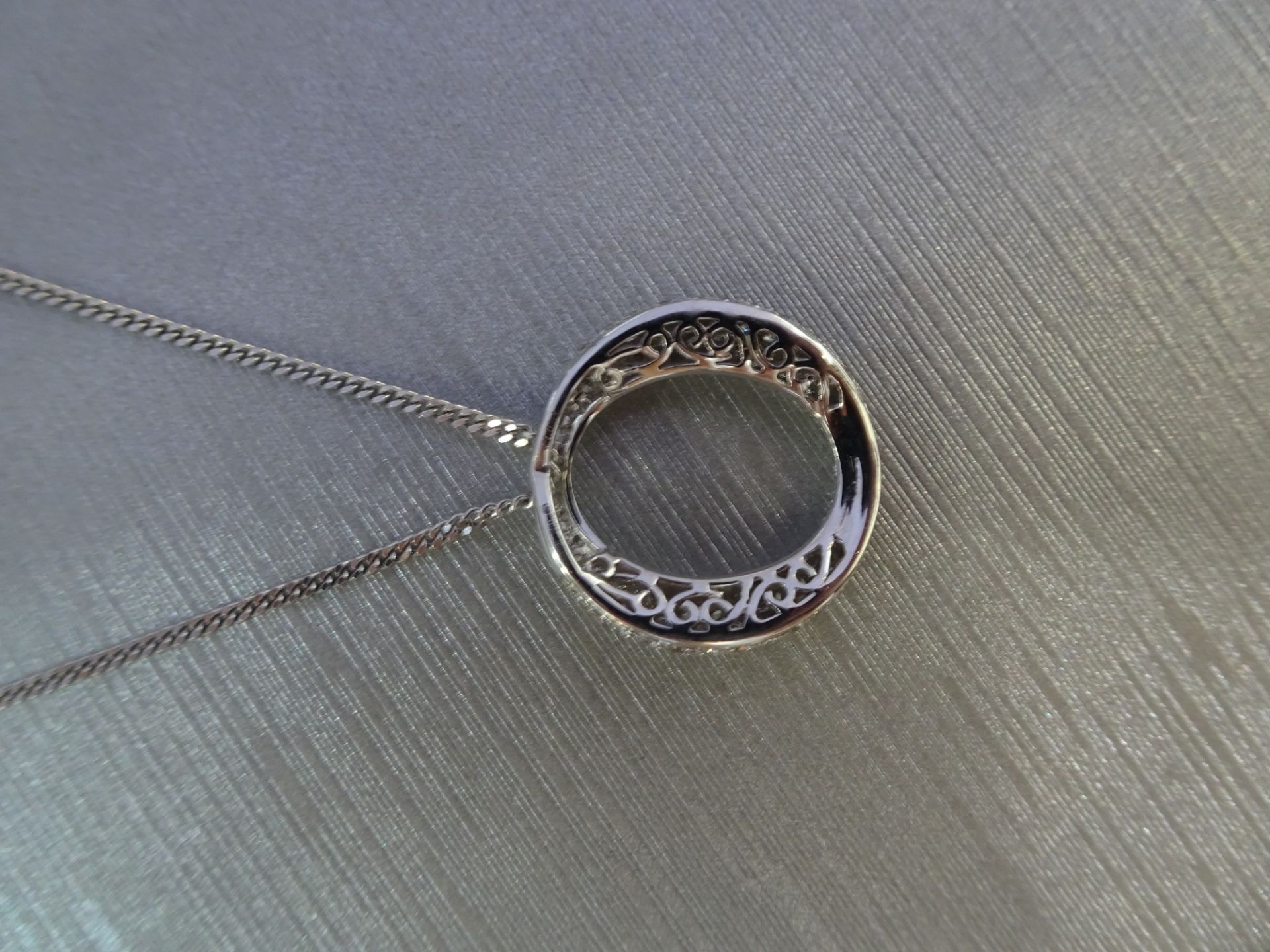 18ct white gold diamond set pendant in an 'o' design. Set with tiny brilliant cut diamonds - Image 2 of 5