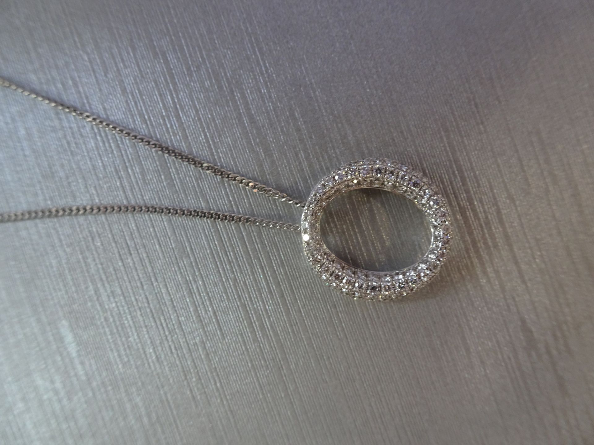 18ct white gold diamond set pendant in an 'o' design. Set with tiny brilliant cut diamonds - Image 3 of 5