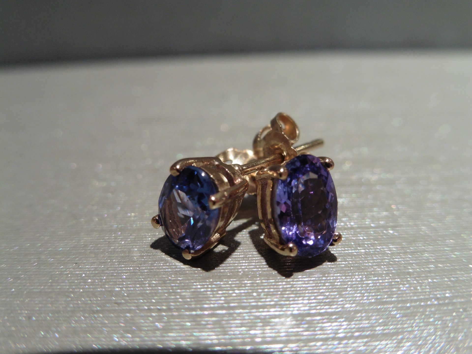 Brand new 9ct gold Tanzanite stud style earrings each set with an oval cut Tanzanite (untreated) 7mm