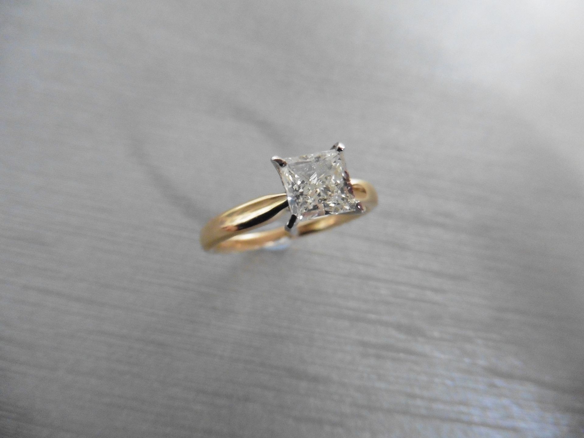 Brand new 18ct gold diamond solitaire ring set with a princess cut diamond weighing 1.00ct. H