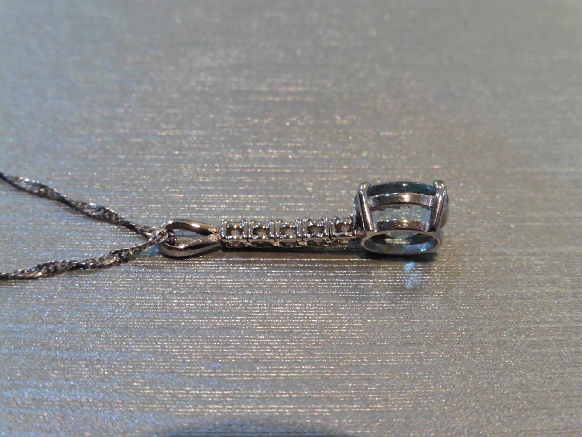 Brand new 9ct White gold aqua marine and diamond drop style pendant set with a 1.50ct oval cut - Image 3 of 3