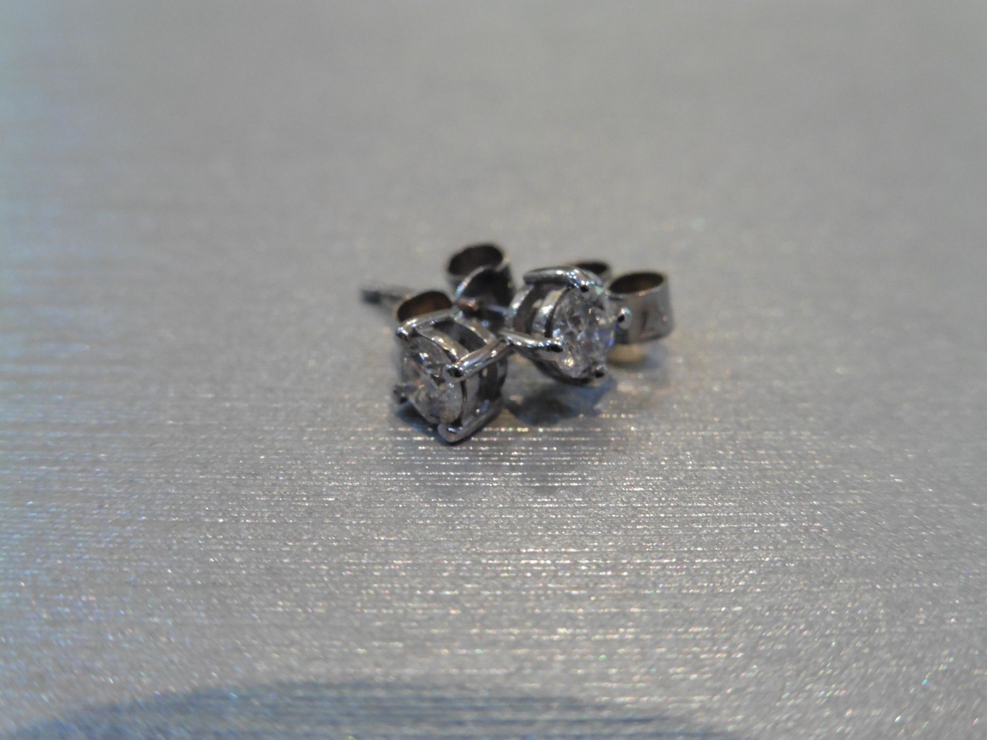 Brand new 18ct white gold solitaire stud earrings each set with a brilliant cut diamond weighing a - Image 2 of 3