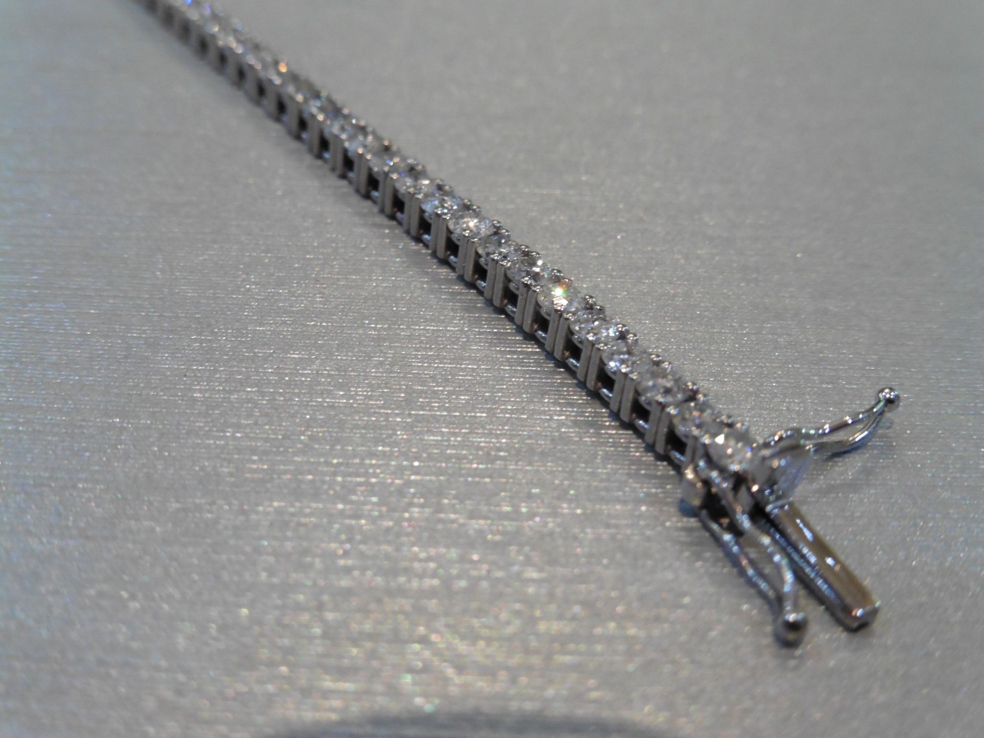 Brand new 18ct white gold tennis bracelet set with brilliant cut diamonds of H/I colour weighing 3. - Image 3 of 4
