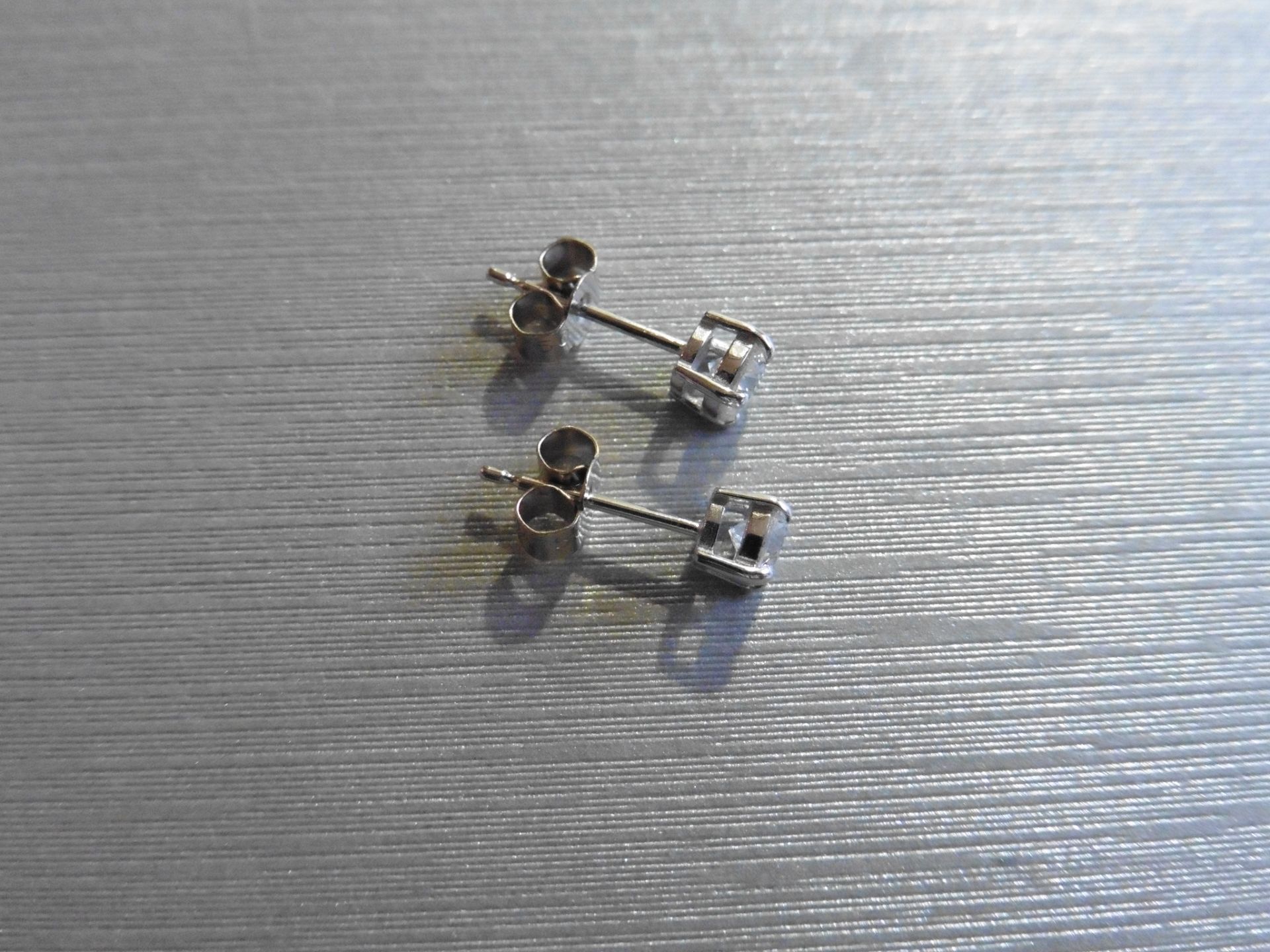 Brand new 18ct white gold solitaire stud earrings each set with a brilliant cut diamond weighing a - Image 3 of 3