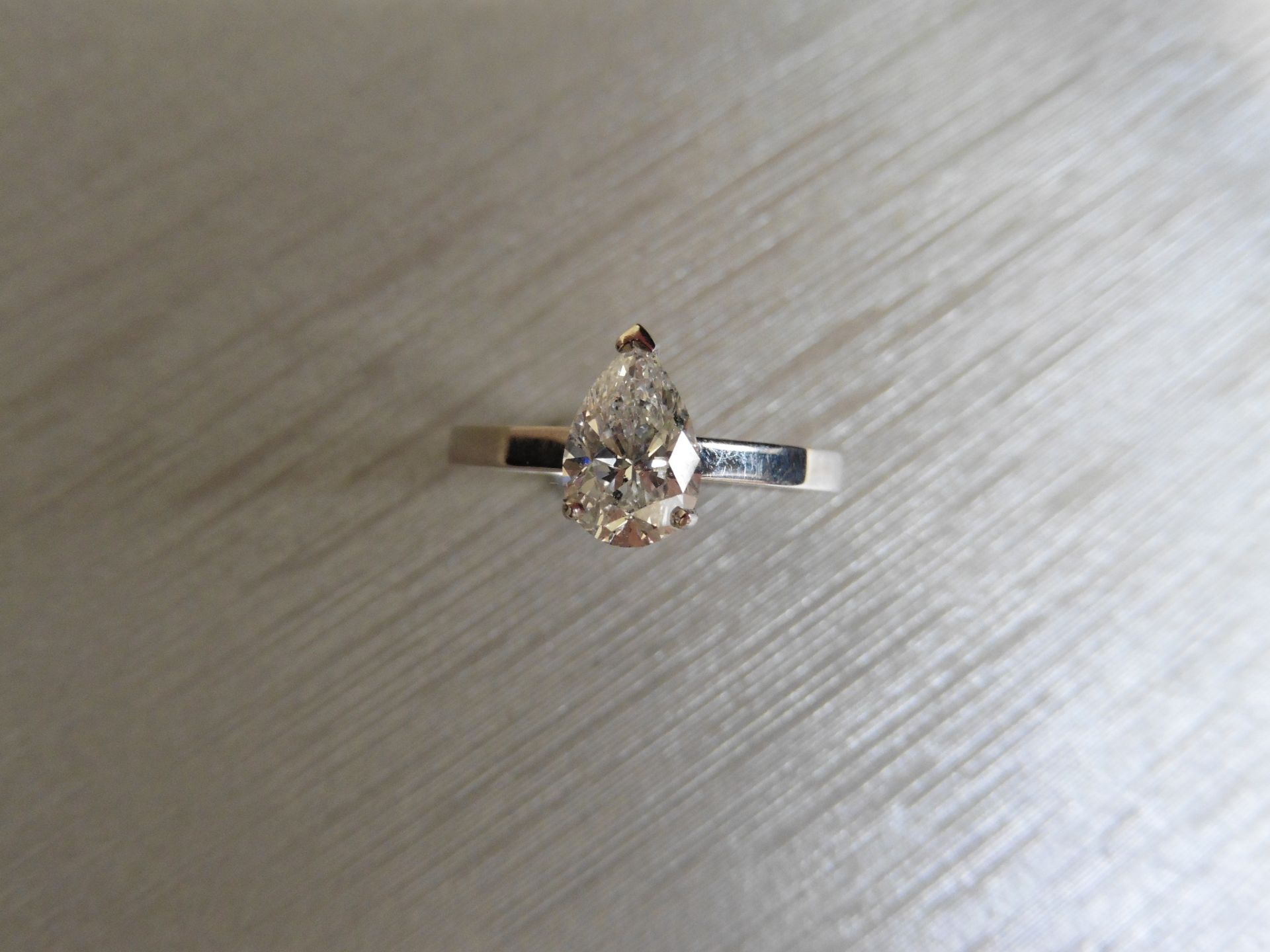 Brand new Platinum diamond solitaire ring. Set with a 1.10ct pear shape diamond (measures 8.67mm x