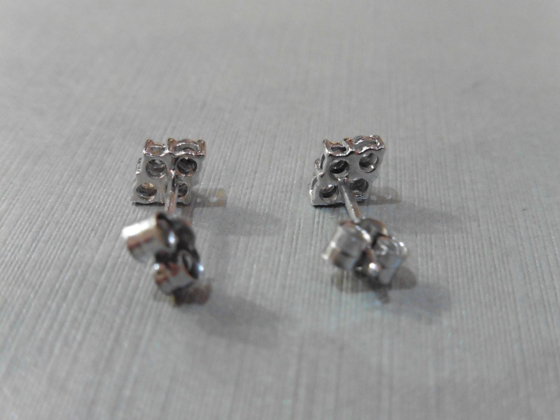 Brand new 9ct white gold diamond cluster style earrings each set with 4 small brilliant cut - Image 2 of 3