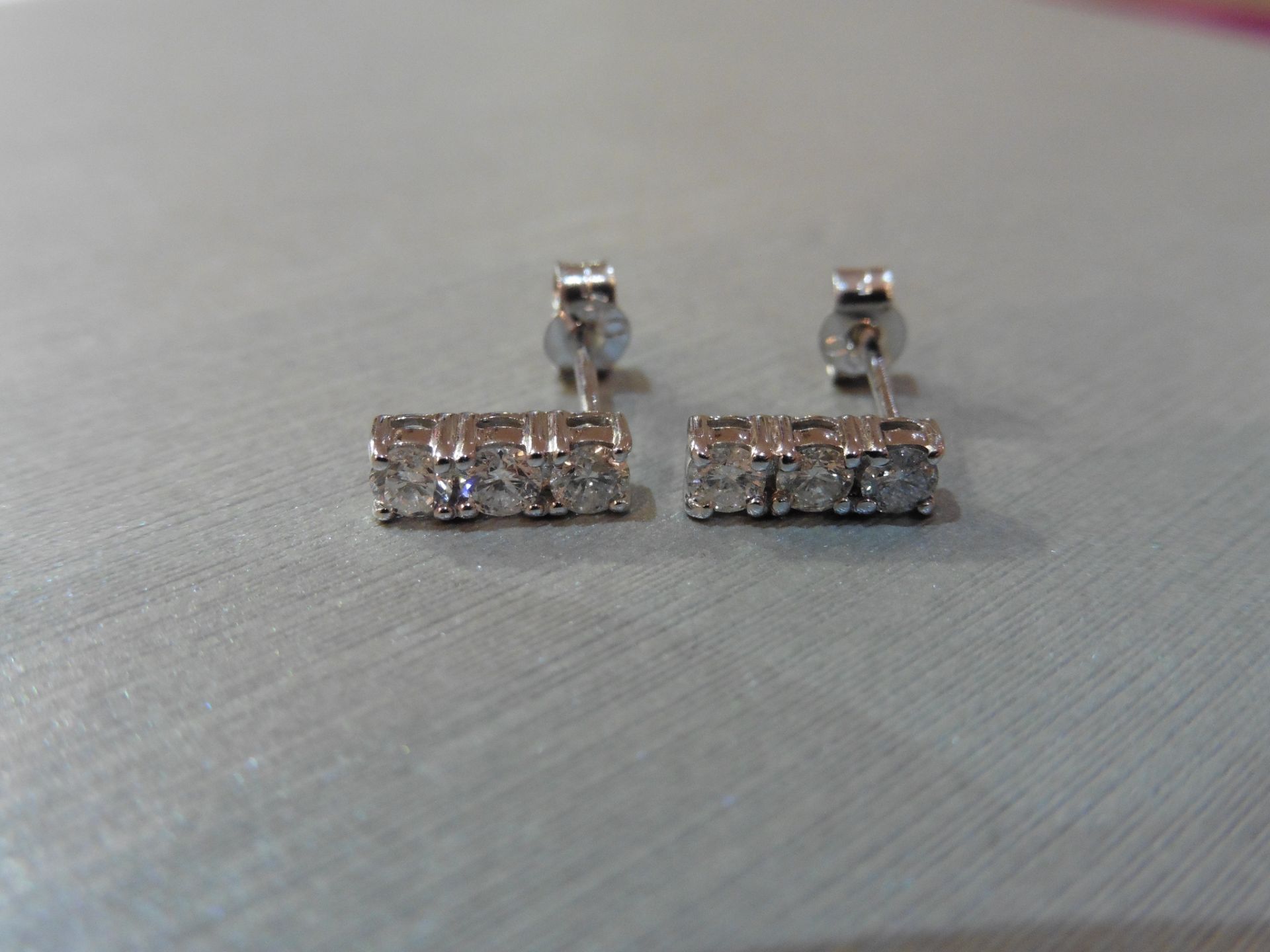 Brand new 18ct white gold diamond trilogy style drop earrings each set with 3 small brilliant cut - Image 3 of 3