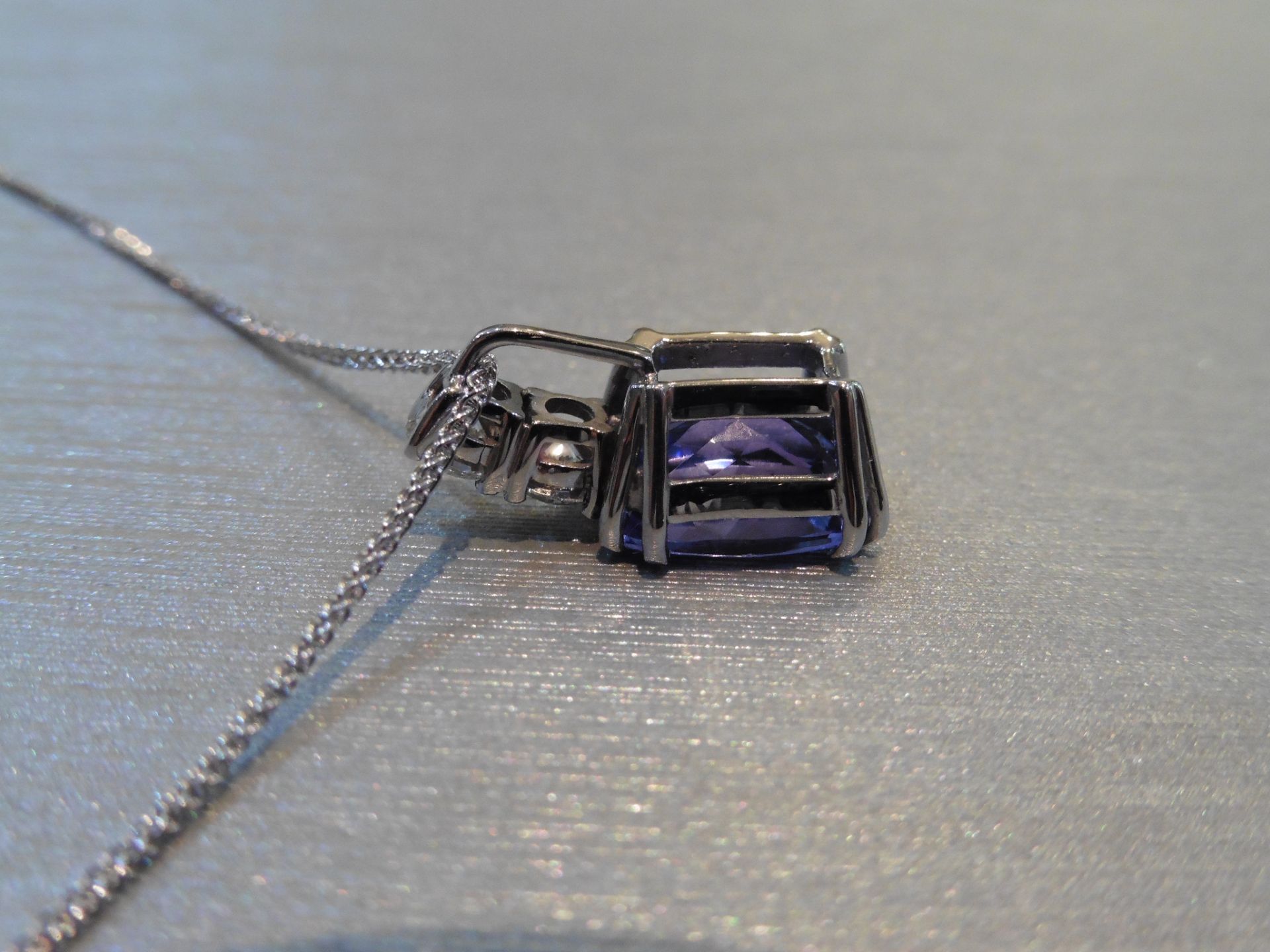 Brand new 18ct white gold Tanzanite and diamond pendant set with a 4.04ct emerald cut AAA - Image 2 of 3