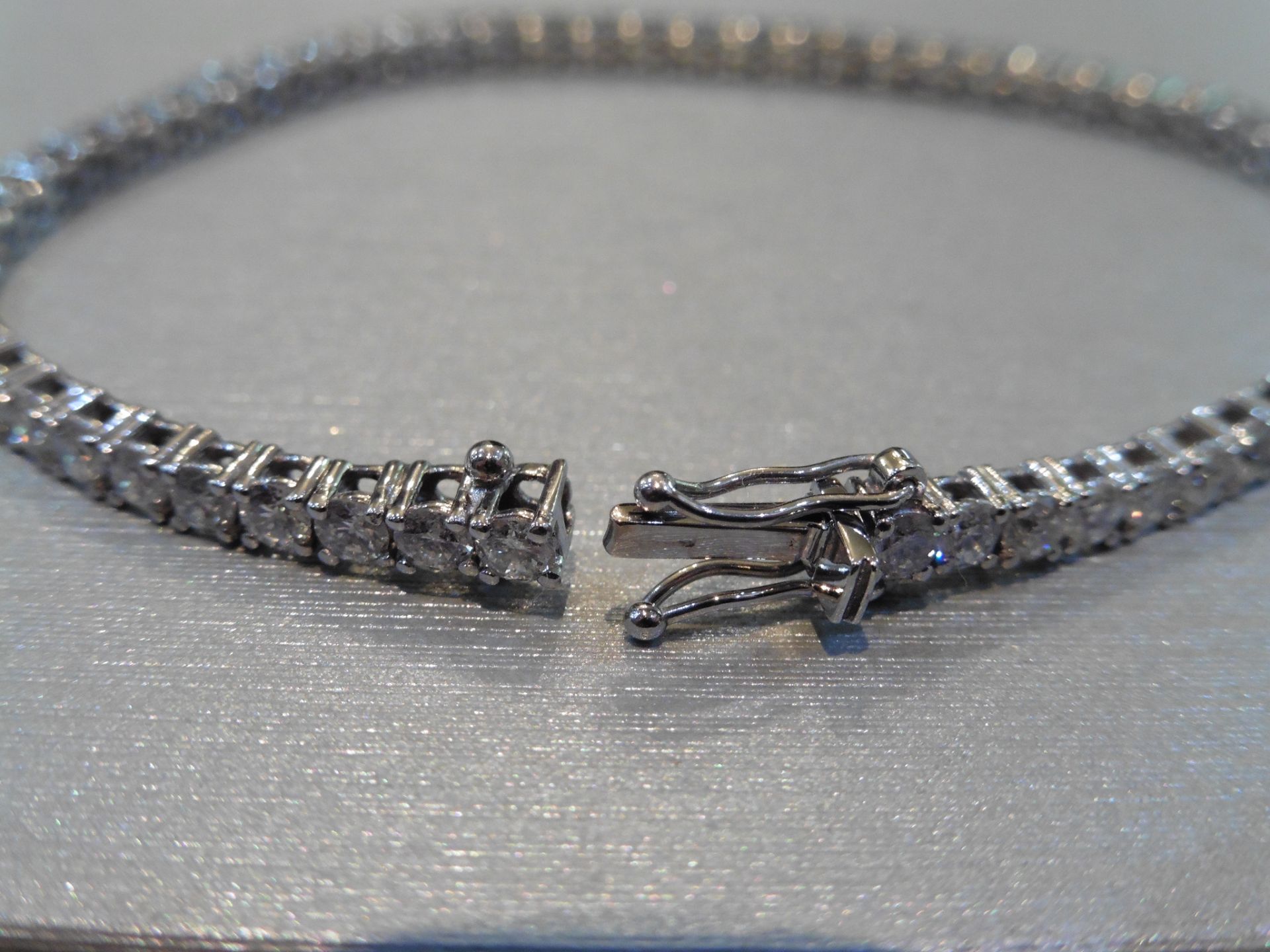 Brand new 18ct white gold tennis bracelet set with brilliant cut diamonds of H/I colour weighing 3. - Image 2 of 4