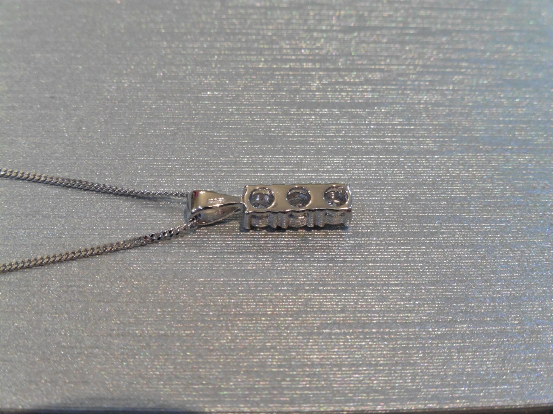 Brand new 18ct white gold trilogy pendant set with 3 small brilliant cut diamonds of H/I colour - Image 2 of 2