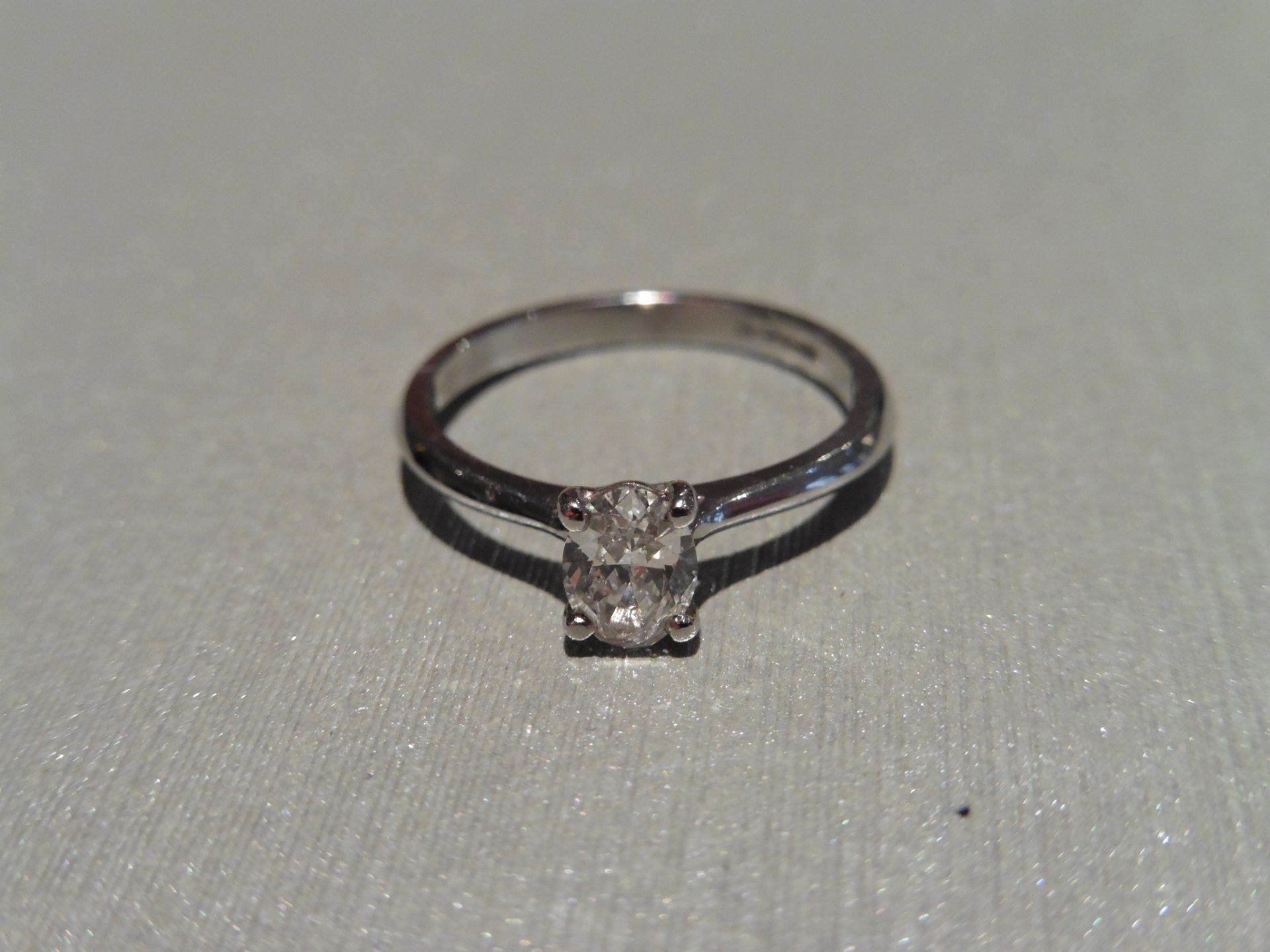 Brand new Platinum diamond solitaire ring set with a 0.41ct oval cut diamond, F colour and si2 - Image 3 of 4