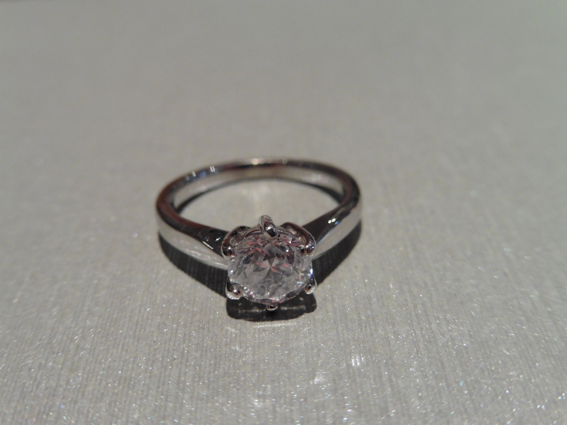 Brand new 18ct white gold diamond solitaire ring set with a 1.00ct brilliant cut diamond of F colour