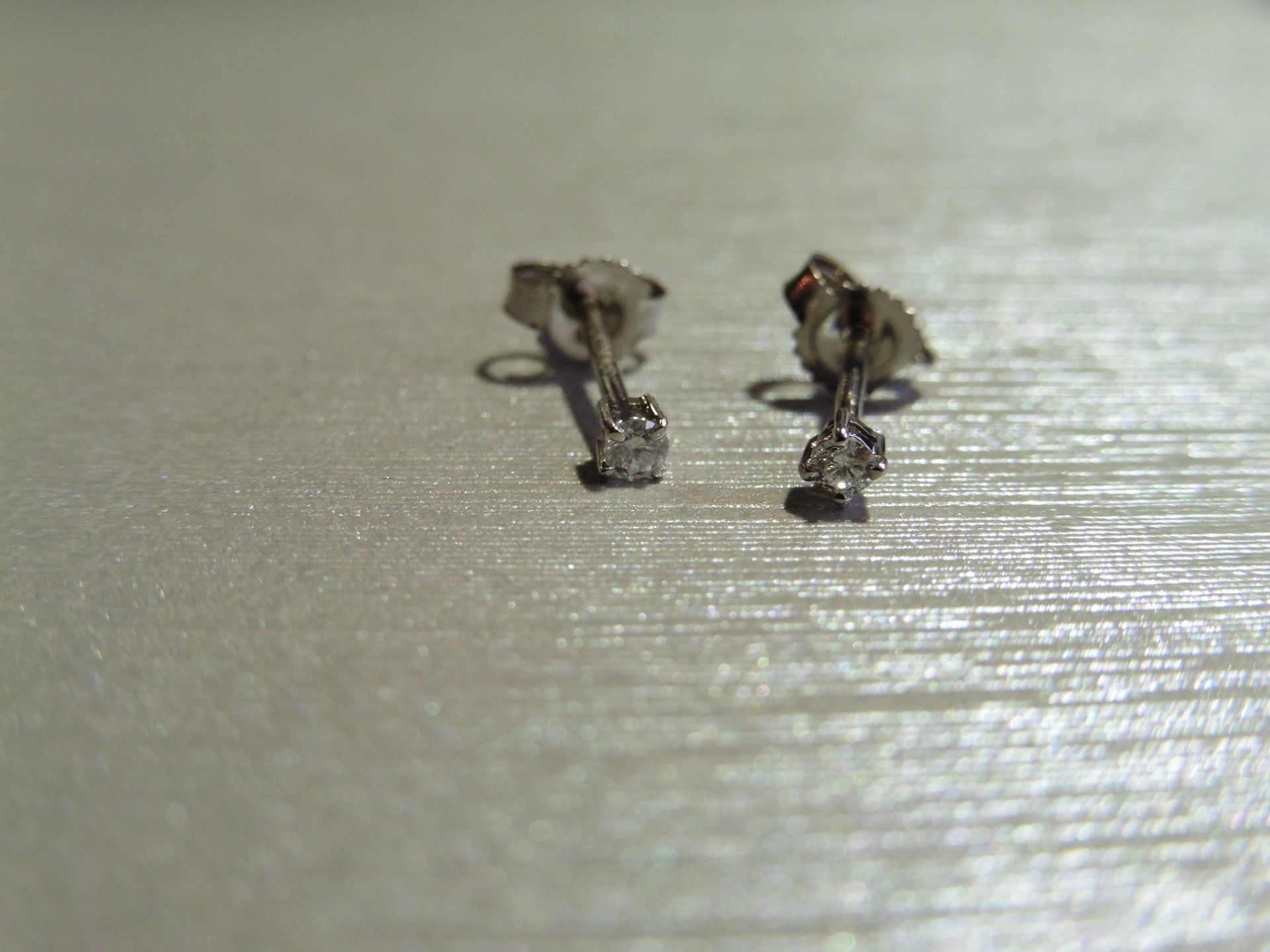 Brand new 9ct white gold solitaire stud earrings each set with a brilliant cut diamond weighing a - Image 3 of 3