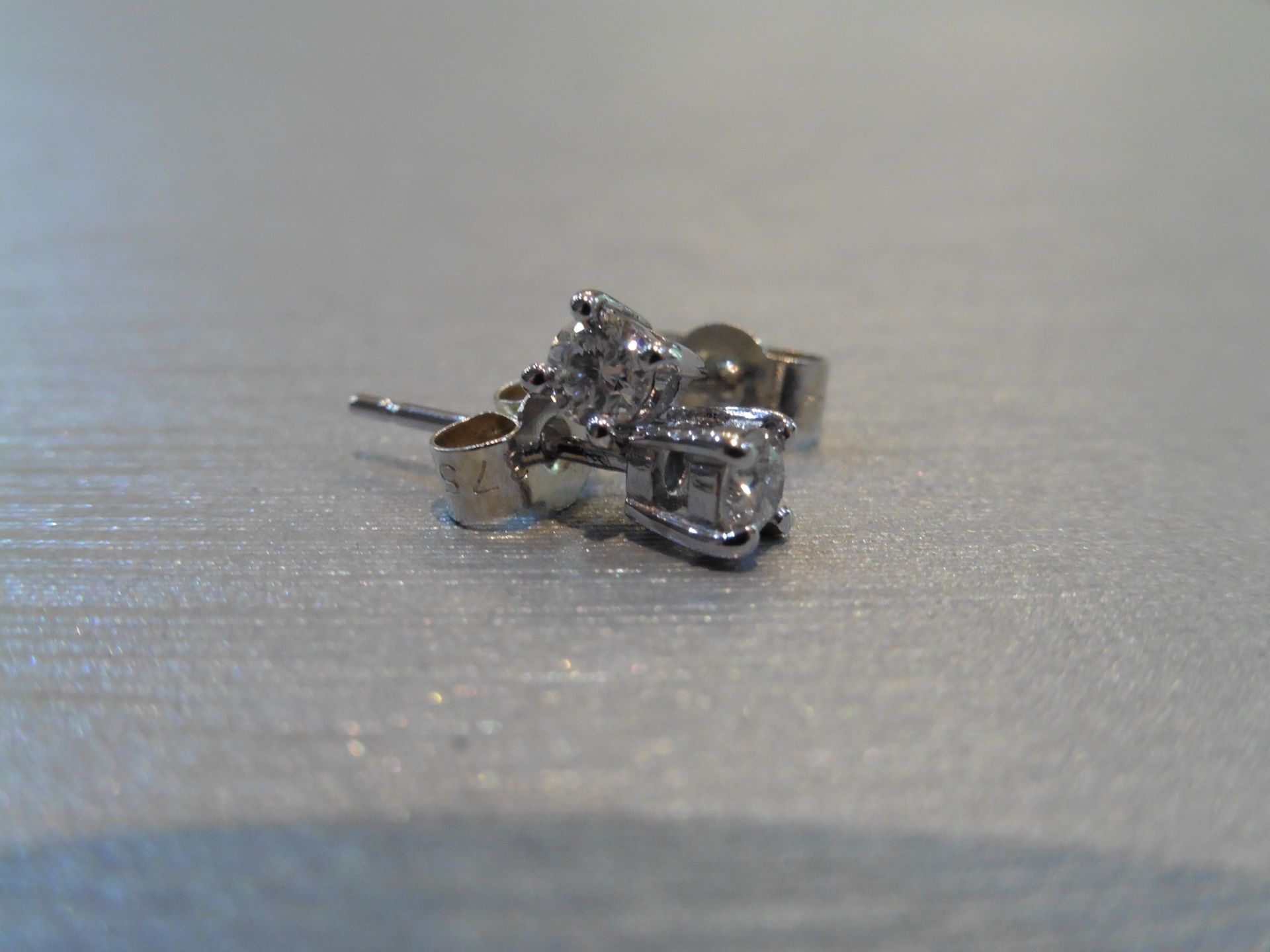 Brand new 9ct white gold solitaire stud earrings each set with a brilliant cut diamond weighing a - Image 3 of 3