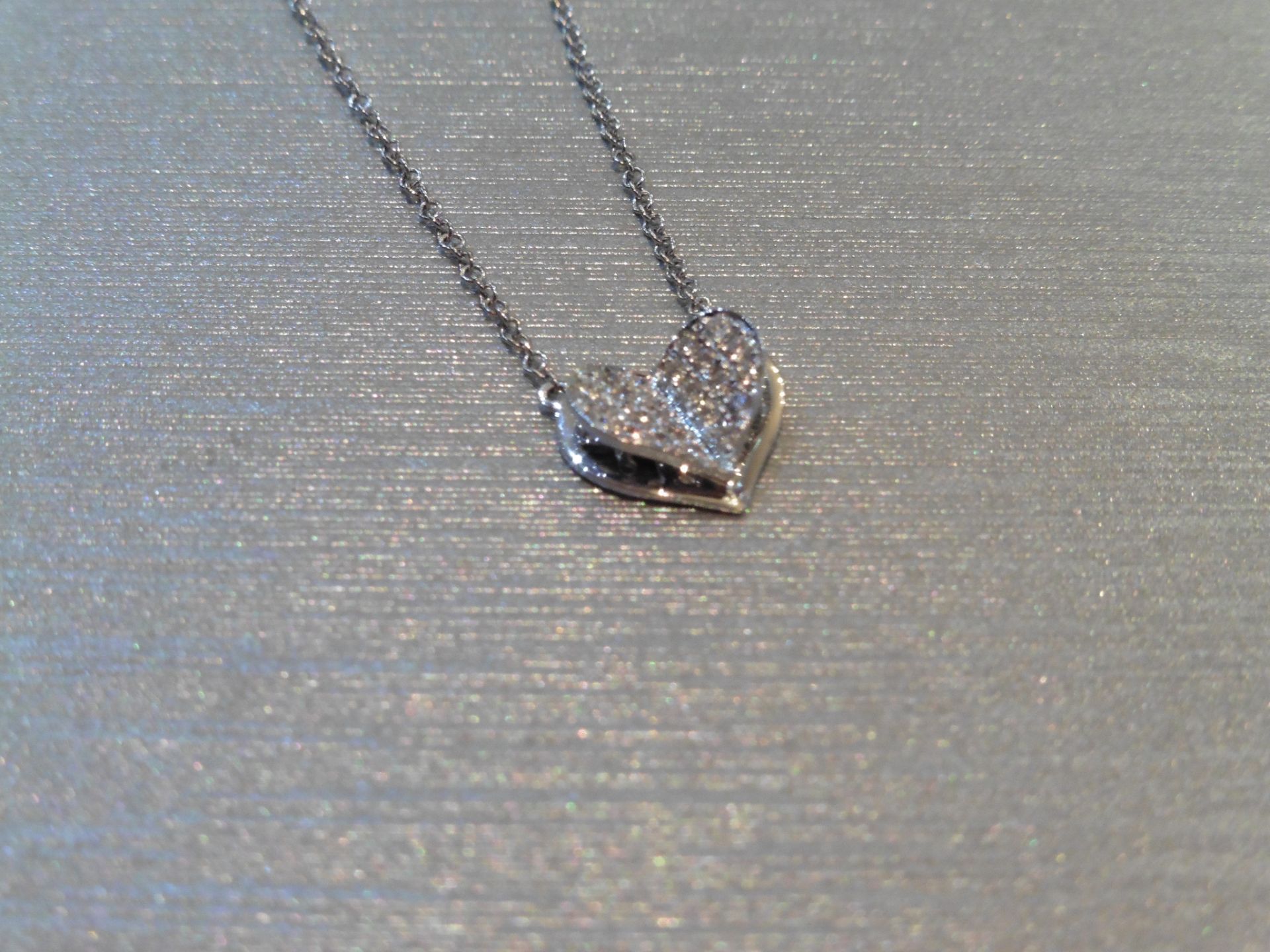 Brand new 18ct white gold diamond set heart pendant and chain. Micro set with tiny brilliant cut - Image 3 of 3
