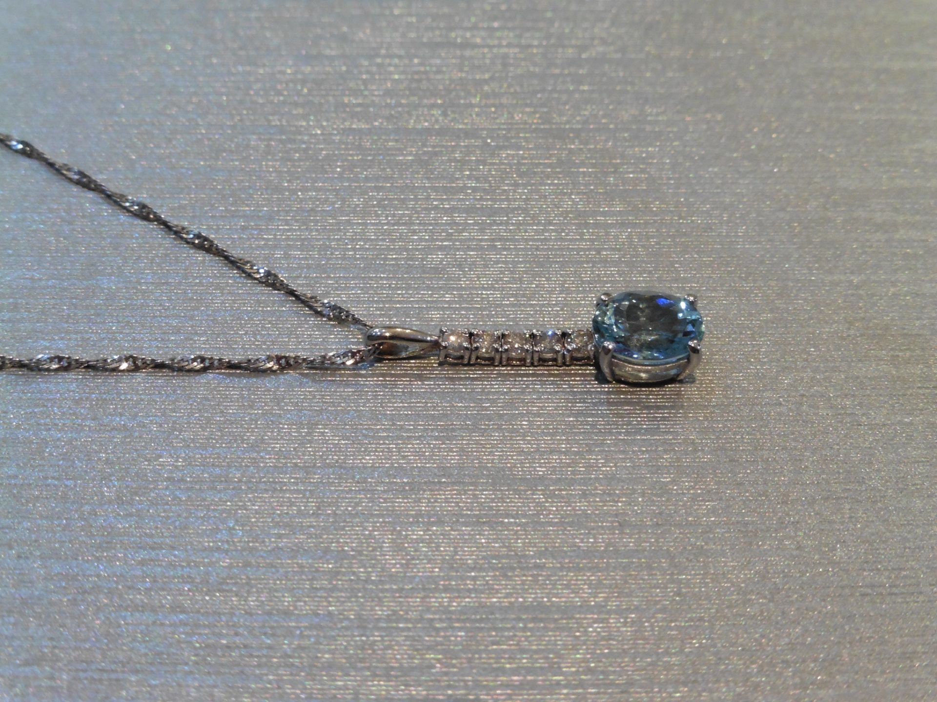 Brand new 9ct White gold aqua marine and diamond drop style pendant set with a 1.50ct oval cut - Image 2 of 3