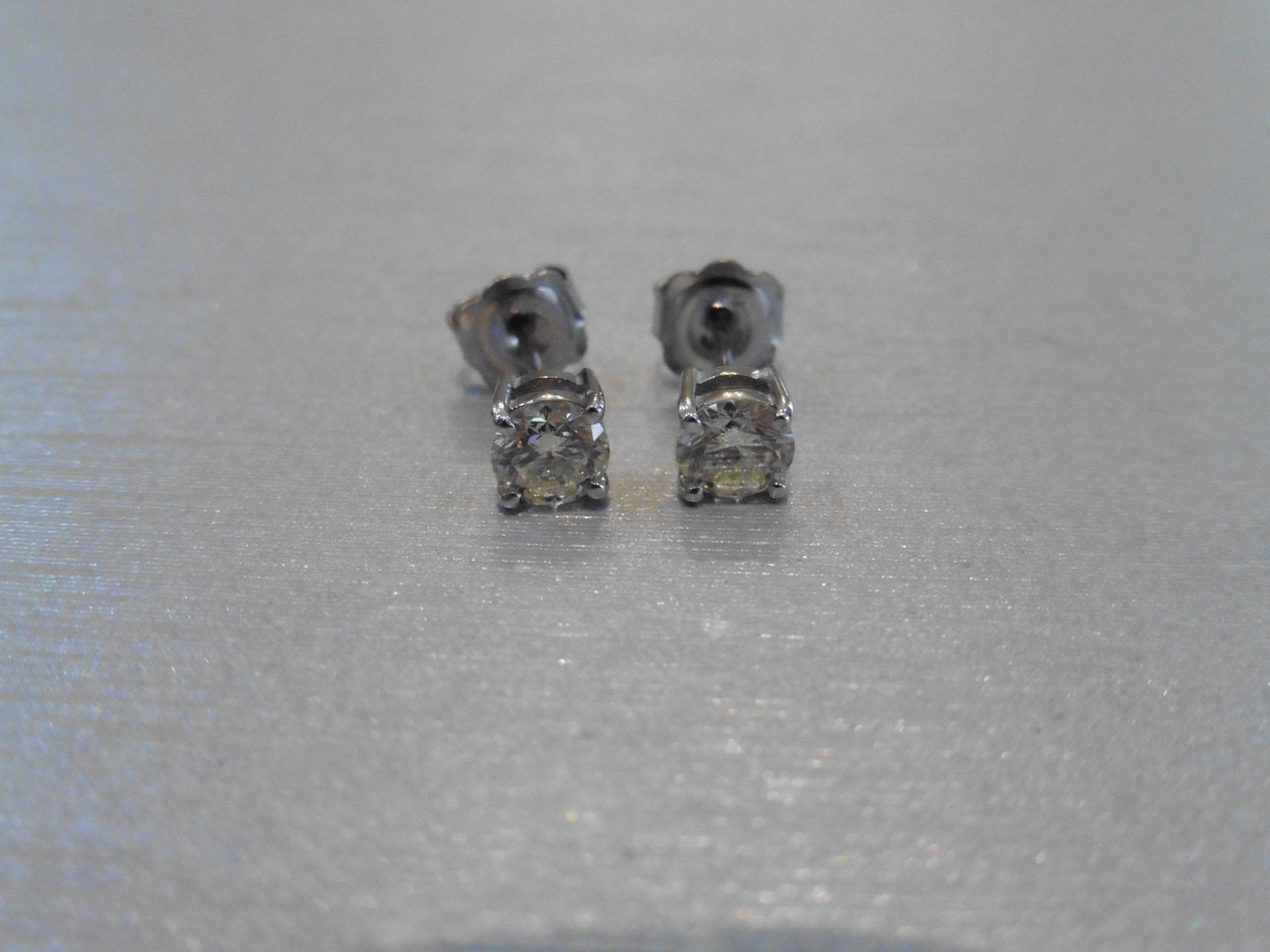 Brand new 18ct white gold solitaire stud earrings each set with a brilliant cut diamond weighing a - Image 3 of 3