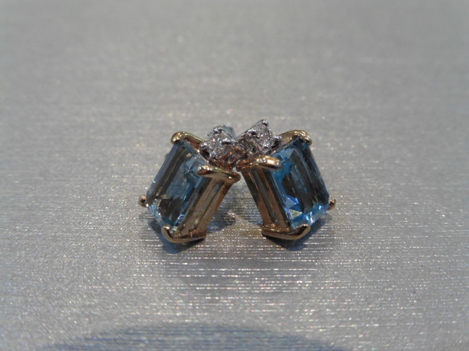 Brand new 9ct gold aqua marine and diamond earrings. Each set with an emerald cut aqua weighing 1. - Image 4 of 4