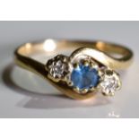 A 9ct Gold Sapphire and Diamond trilogy twist ring,