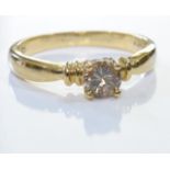 A 9ct gold chocolate diamond ring. A 'Chocolate' brilliant-cut diamond single-stone ring,