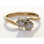A 9ct gold diamond rings. Two brilliant cut diamonds mounted in 9ct. Total carat weight .2 cts -