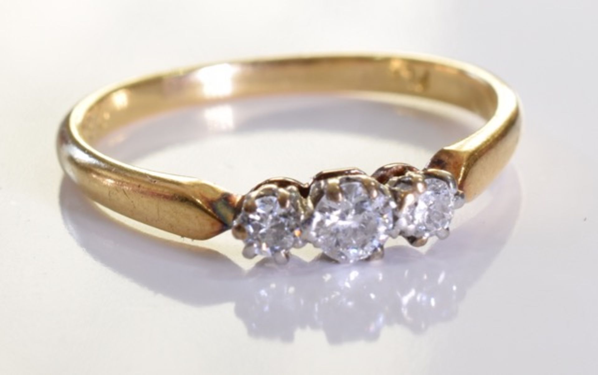 An 18ct Gold & Diamond Ring, Three graduated brilliant cut diamonds, set in 18ct gold. 2.4grms - - Image 2 of 4