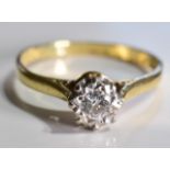 An 18ct Gold Diamond Single stone ring, The brilliant cut diamond in an illusion setting within a