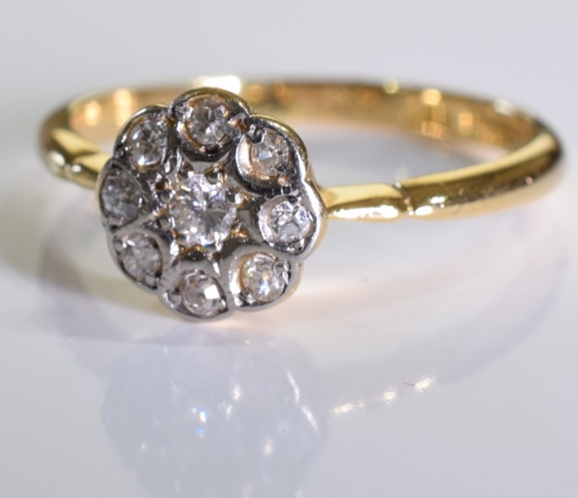 An 18ct gold diamond floral cluster ring. 2.3 grms - size M. - Image 2 of 3