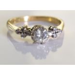 An 18ct gold diamond single-stone ring. The brilliant-cut diamond, raised to the single-cut