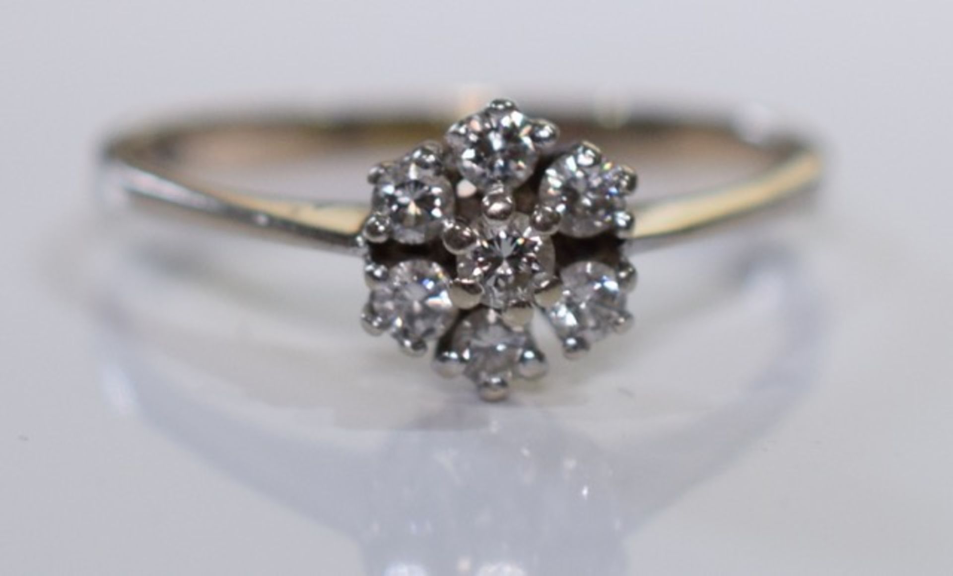 A 14ct Gold Diamond flower cluster ring with around .28 carats of diamonds - size m/n