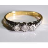 A 9ct gold and diamond ring, 3 graduated diamonds set side by side in a 9ct gold ring. 1.6 grms -