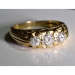 A 9ct gold diamond ring. Three graduated brilliant-cut diamond set in a 9 ct gold cast ring.