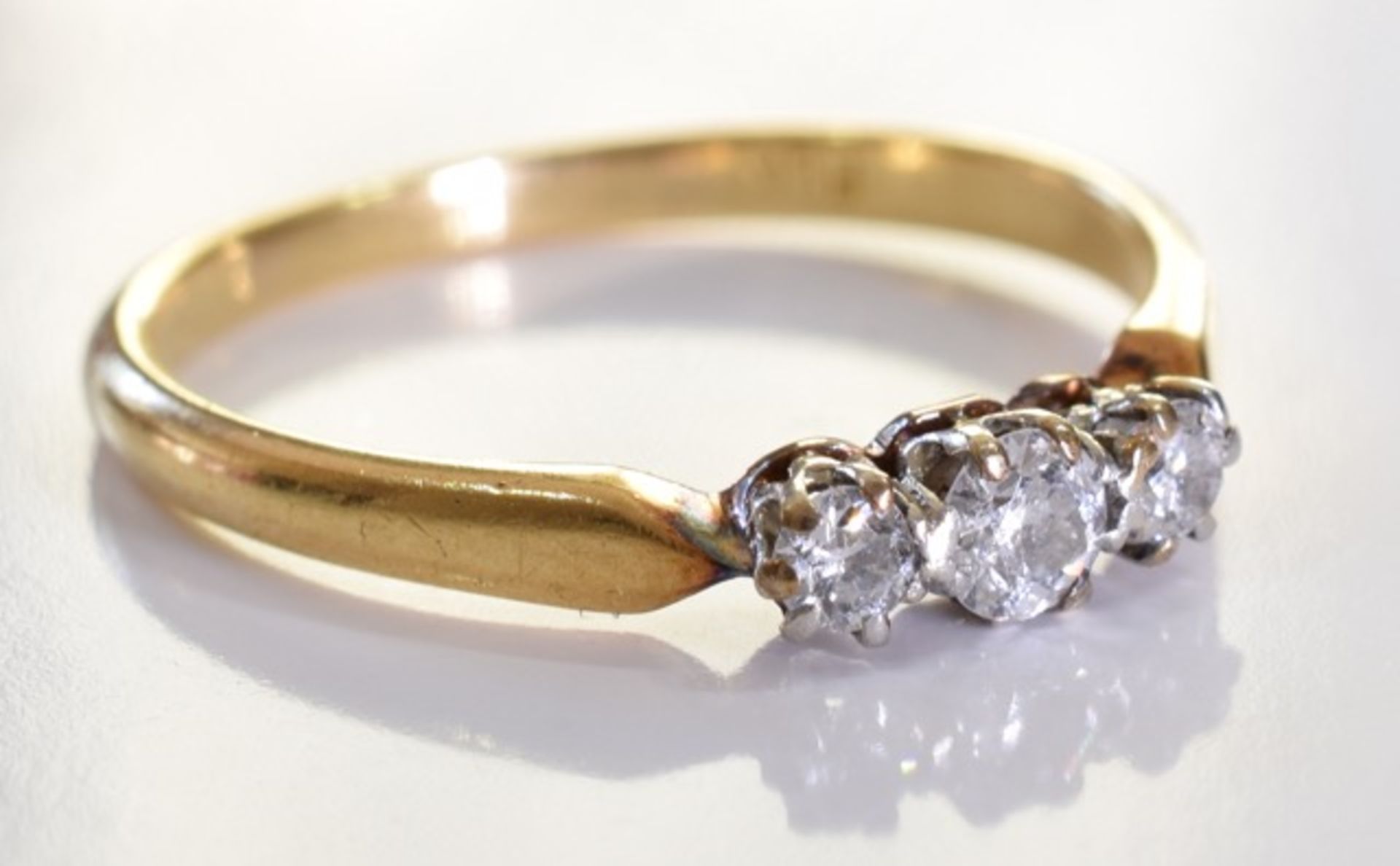 An 18ct Gold & Diamond Ring, Three graduated brilliant cut diamonds, set in 18ct gold. 2.4grms - - Image 4 of 4