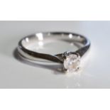 An 18ct gold diamond single-stone ring. The brilliant-cut diamond, to the tapered band. Estimated