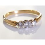 An 18ct Gold & Diamond Ring, Three graduated brilliant cut diamonds, set in 18ct gold. 2.4grms -